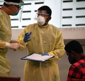 Migrant workers volunteer to help curb coronavirus spread in dorms